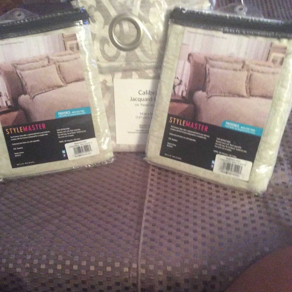 Beige Pillow shams and matching valance.